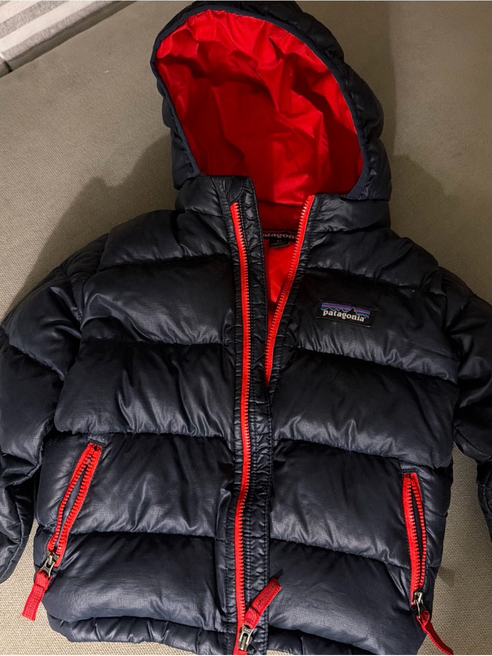 Patagonia Kids Navy Puffer Jacket with Red Lining and Trim .